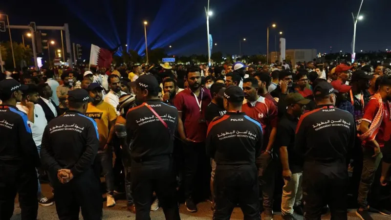 During Qatar's loss to Ecuador, host nation's riot police push back crowds at World Cup fan zone in Central Doha
