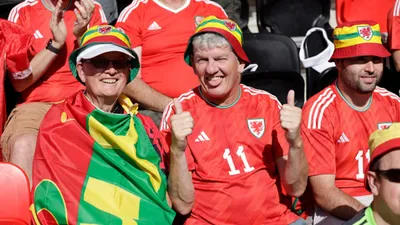 Slight reprieve for Wales fans as FIFA bows down to pressure reverses ban on rainbow hats and armbands 