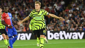 Martin Odegaard's penalty seals a nervy win for 10-man Arsenal