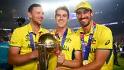 Josh Hazlewood (L), Pat Cummins (M) and Mitchell Starc (R) of Australia pose for a photo with the ICC Men's Cricket World Cup Trophy after the ICC Men's Cricket World Cup India 2023 Final between India and Australia at Narendra Modi Stadium on November 19, 2023 in Ahmedabad, India. (Getty Images)