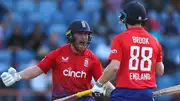 England's Phil Salt (L) and Harry Brook (R) celebrate victory over West Indies in the 4th T20I. (Getty)