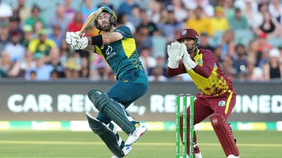 AUS vs WI : ग्लेन मैक्सवेल के तूफानी शतक से 242 रनों के लक्ष्य के आगे वेस्टइंडीज ने टेके घुटने, ऑस्ट्रेलिया ने 34 रन की जीत से T20I सीरीज पर जमाया कब्ज़ा  - glenn maxwell hundred 120 runs australia beat west indies by 34 runs in 2nd T20I aus vs wi