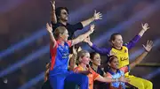 Bollywood actor Shah Rukh Khan (L, top) and WPL teams' captains gesture during season two's glitzy opening ceremony. (Getty Images)