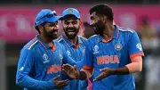 India's Jasprit Bumrah (R) celebrates with teammate Virat Kohli (C) and captain Rohit Sharma in this frame. (Getty)