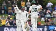 Alex Carey and Pat Cummins celebrate after winning the match against New Zealand.