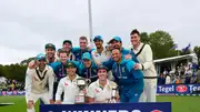 Australian players posing with the trophy.