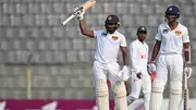 Sri Lanka's Kamindu Mendis (L) celebrates after scoring a century during the third day of the first Test against Bangladesh on March 24. (Getty)