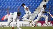 Sri Lanka's Kusal Mendis (R) and Dimuth Karunaratne (C) run between the wickets during the first day of the 2nd Test against Bangladesh in Chittagong on March 30. (Getty)