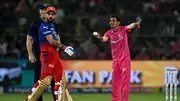 Rajasthan Royals' Yuzvendra Chahal (R) gestures as Royal Challengers Bengaluru's Virat Kohli (C) looks on during their IPL 2024 match on April 6. (Getty)