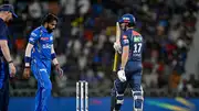 Lucknow Super Giants' Marcus Stoinis (right) celebrates after scoring a half-century (50 runs) as Mumbai Indians' captain Hardik Pandya (C) looks on during the IPL 2024 clash on April 30. (Getty)