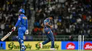 Lucknow Super Giants' Mayank Yadav (R) celebrates after taking the wicket of Mumbai Indians' Mohammad Nabi during their IPL 2024 clash on April 30. (Getty)