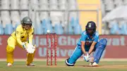 India's Harmanpreet Kaur (right) plays a shot during women's One Day International Match between India and Australia at Wankhede Stadium on December 28, 2023. (Getty)