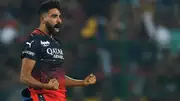 Royal Challengers Bangalore's Mohammed Siraj celebrates after taking the wicket of Gujarat Titans' Wriddhiman Saha. (Getty)