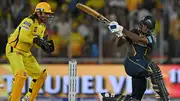 Gujarat Titans' Sai Sudharsan (R) plays a shot as Chennai Super Kings' wicketkeeper MS Dhoni looks on during their IPL 2024 clash on May 10. (Getty)