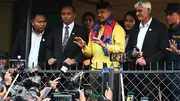 Former Nepal cricket captain Sandeep Lamichhane (C) gestures to fans and media gathered outside Patan High court at Lalitpur district in Kathmandu (Getty Images)