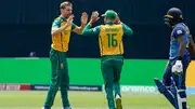 Anrich Nortje celebrates a wicket with teammate Keshav Maharaj (Getty Images)