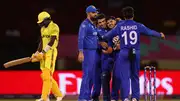 Afghanistan's Fazalhaq Farooqi celebrates with teammate after dismissing Robinson Obuya of Uganda during their T20 World Cup 2024 match on June 4. (Getty)