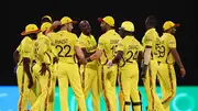 Uganda's Frank Nsubuga celebrates with teammates after a successful DRS review to dismiss Hiri Hiri of Papua New Guinea during their T20 World Cup match on June 6. (Getty)