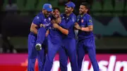 Afghanistan's Fazalhaq Farooqi celebrates with teammates after dismissing Matt Henry of New Zealand during their T20 World Cup 2024 match on June 8. (Getty)