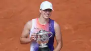 Poland's Iga Swiatek celebrates with the French Open 2024 trophy after defeating Italy's Jasmine Paolini in the women's singles final match on June 8. (Getty)