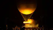 The cauldron, with the Olympic flame lit, lifts off while attached to a balloon during the Opening Ceremony of the Olympic Games Paris 2024 on July 26 (Getty Images)