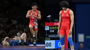 Rei Higuchi after winning the final bout, Vinesh Phogat during her semifinal clash (Getty Images)