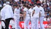 England bowler Mark Wood shakes hands with Harry Brook after the pair combined to dismiss Sri Lanka's Dimuth Karunaratne during day three of the first Test on August 23 in Manchester. (Getty)