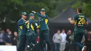 Australia wicketkeeper Josh Inglis is congratulated by team mates after catching out Michael Jones during 2nd T20I against Scotland on September 6. (Getty)